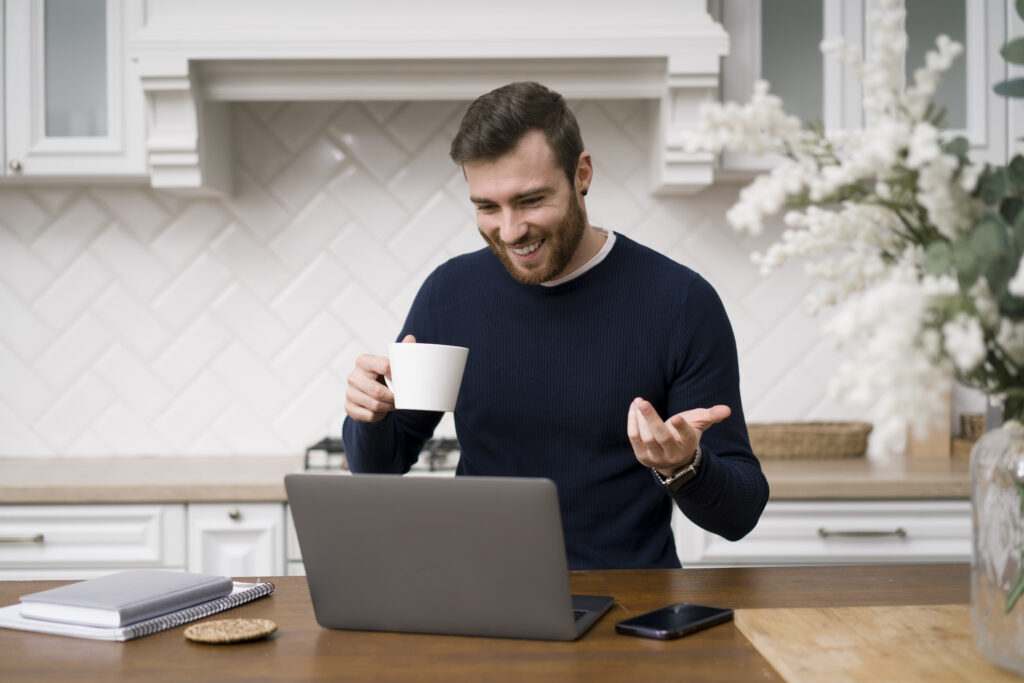 Person quietly quitting by closing laptop and smiling work from home